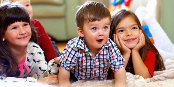 Happy Kids watching TV in the Family Room